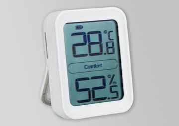 Ansicht auf ein weiß umrandetes Thermometer als viereckigen Kasten.