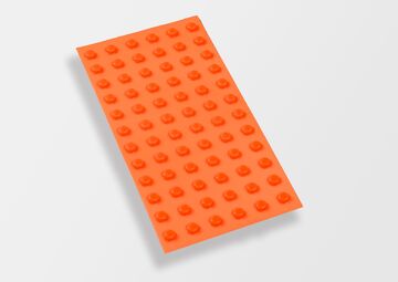 Ansicht auf einen orangenen Streifen mit erhabenen Punkten.