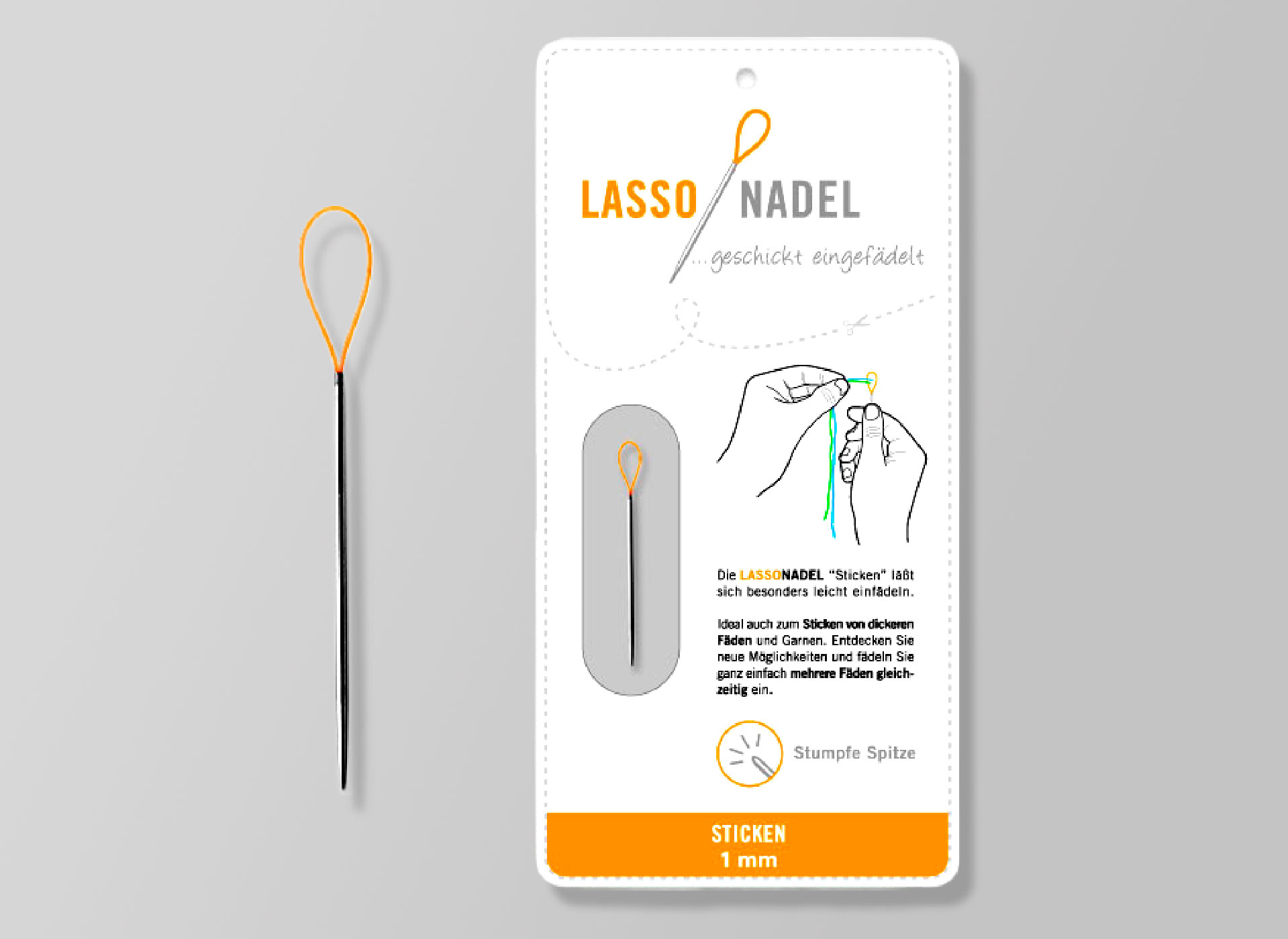 Ansicht auf die Verpackung und links daneben die Nadel mit Schlaufe.